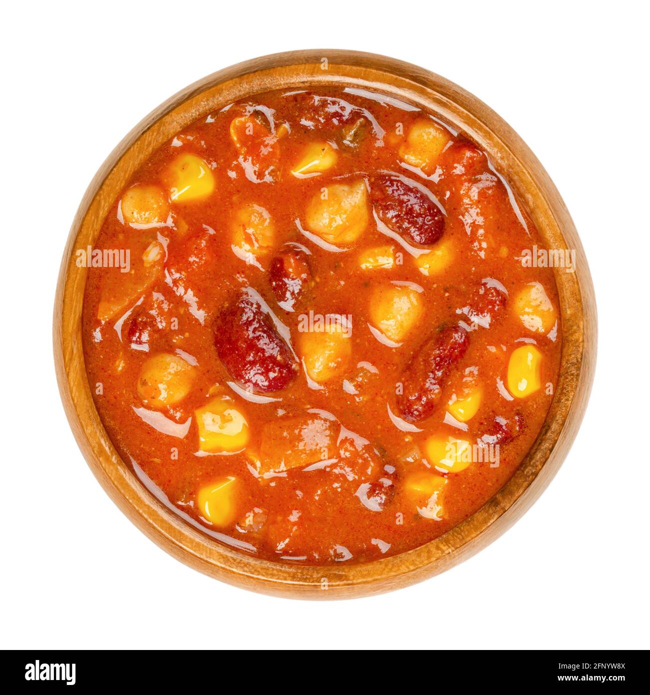 Vegetarian chili in a wooden bowl. Also chili sin carne, a spicy stew containing chili powder, tomatoes, kidney beans, chickpeas, onions, corn grains. Stock Photo