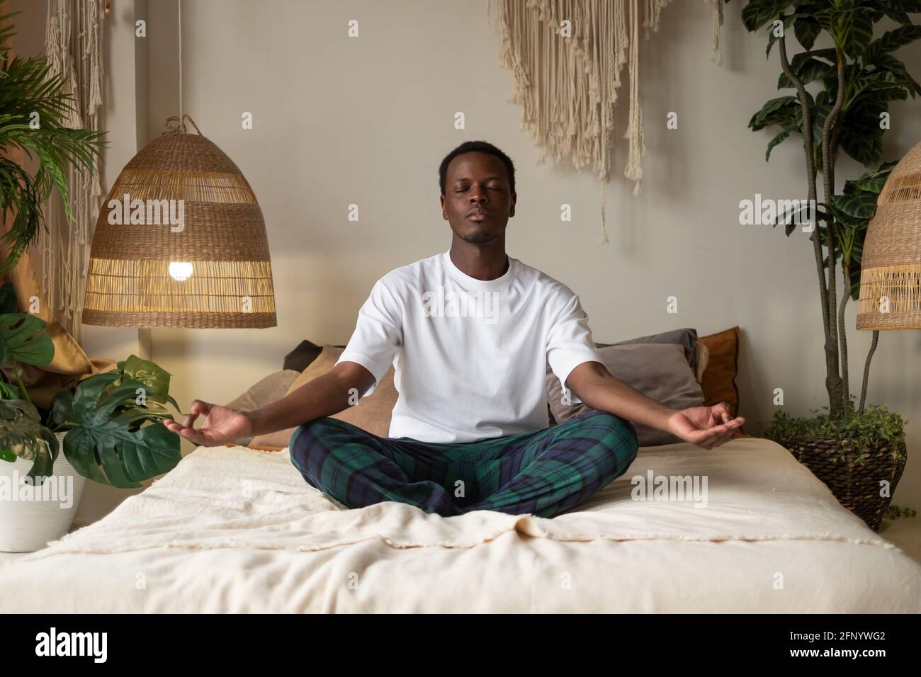 Handsome young man sitting on hi-res stock photography and images - Alamy