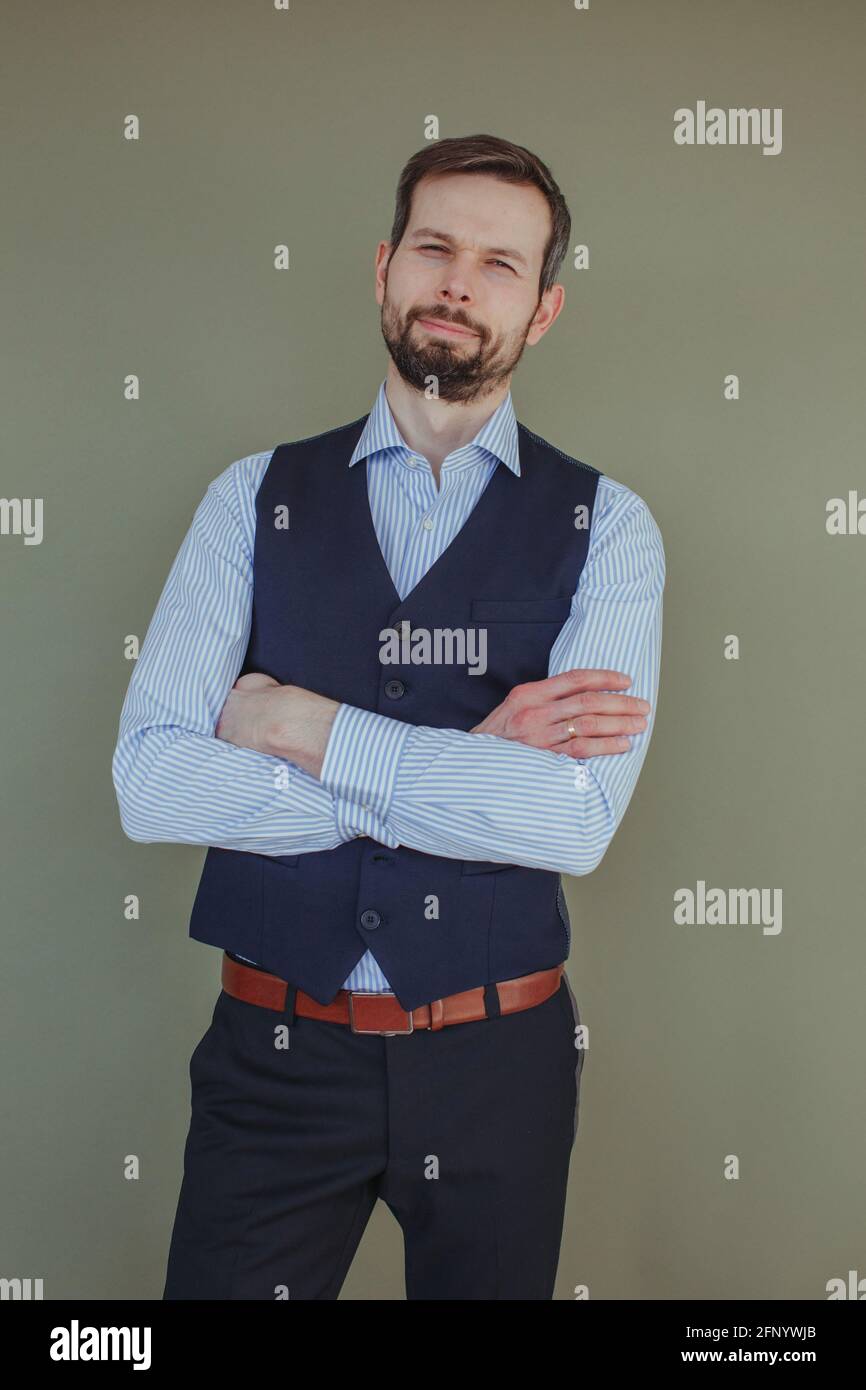 Portrait of a handsome man with a beard wearing a shirt and waistcoat Stock Photo