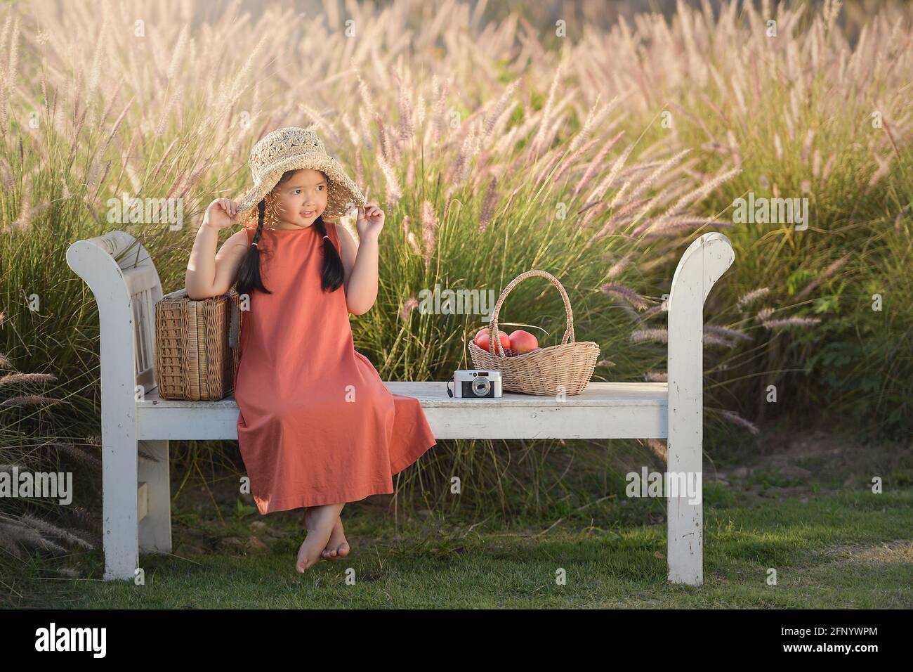 Asian girl sitting on bench hi-res stock photography and images - Alamy