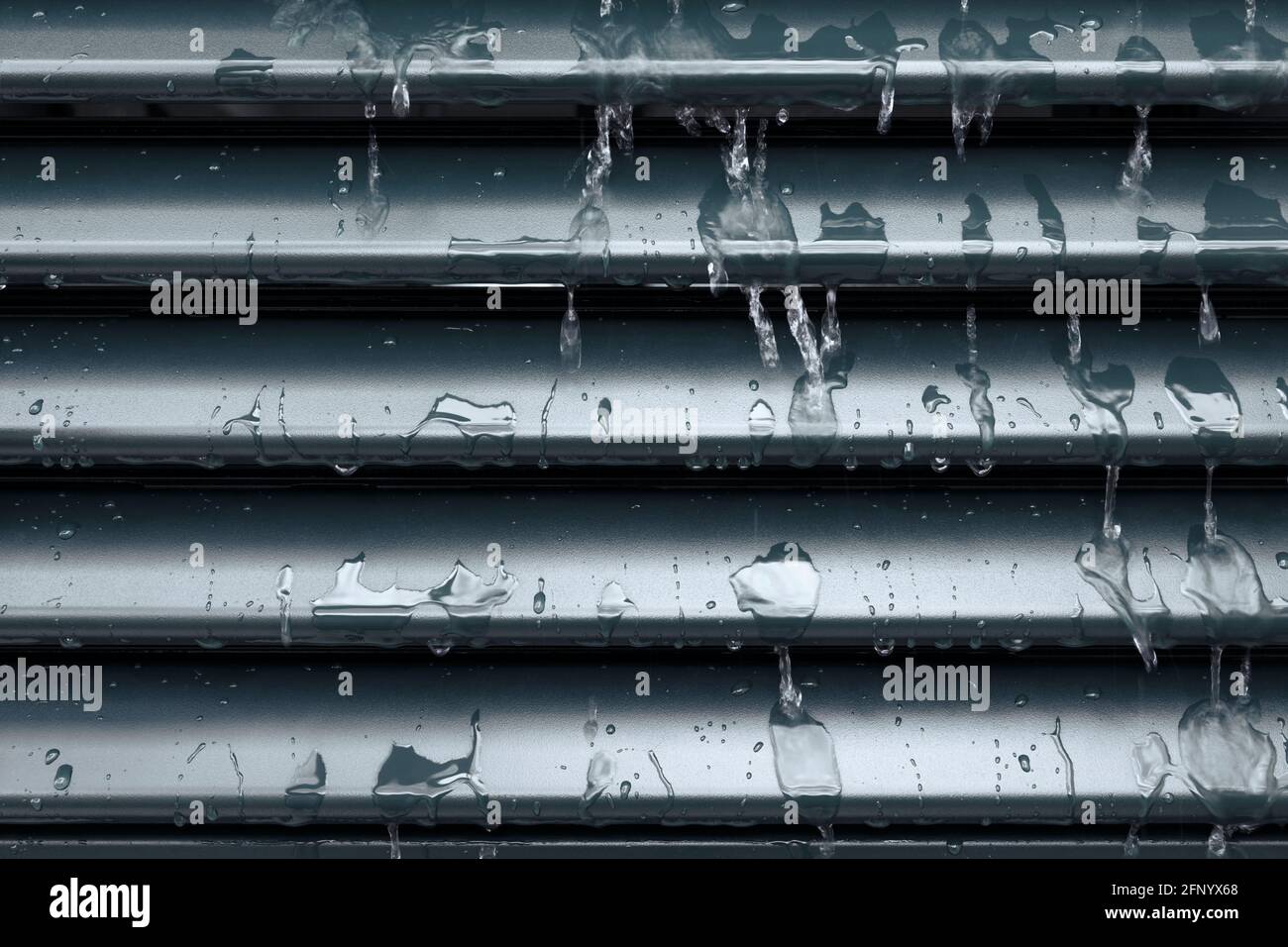 Raindrops and drip water on the shutter, detail Stock Photo