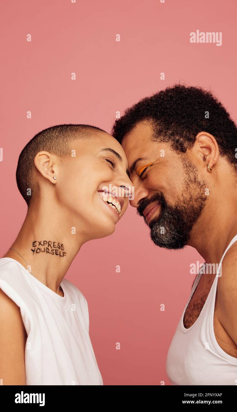Androgynous man and woman together. Friends representing the LGBTQ community Stock Photo