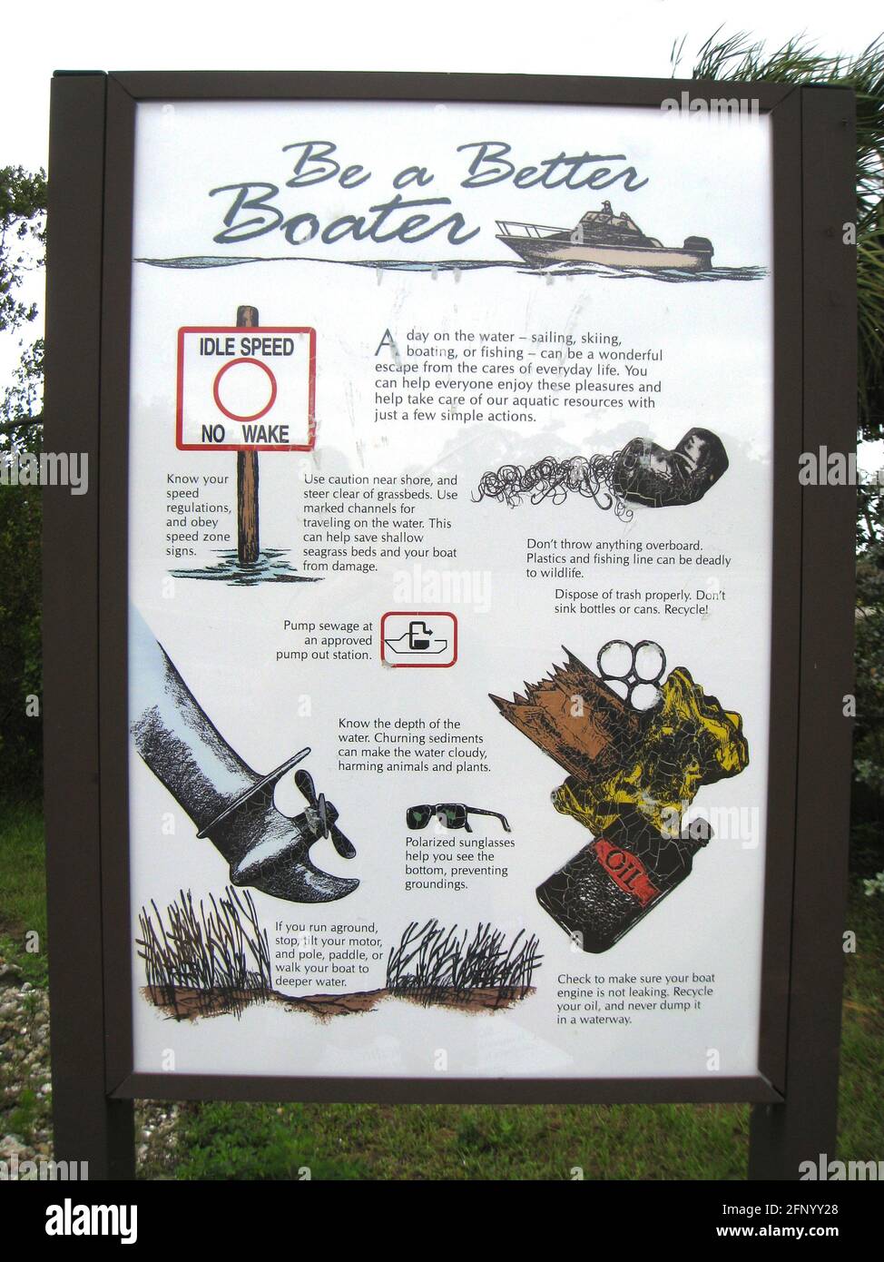 A "Be A Better Boater" sign next to a public boat ramp in Florida, USA, lists ways for recreational boaters to enjoy their time on the water and also protect aquatic resources. Stock Photo