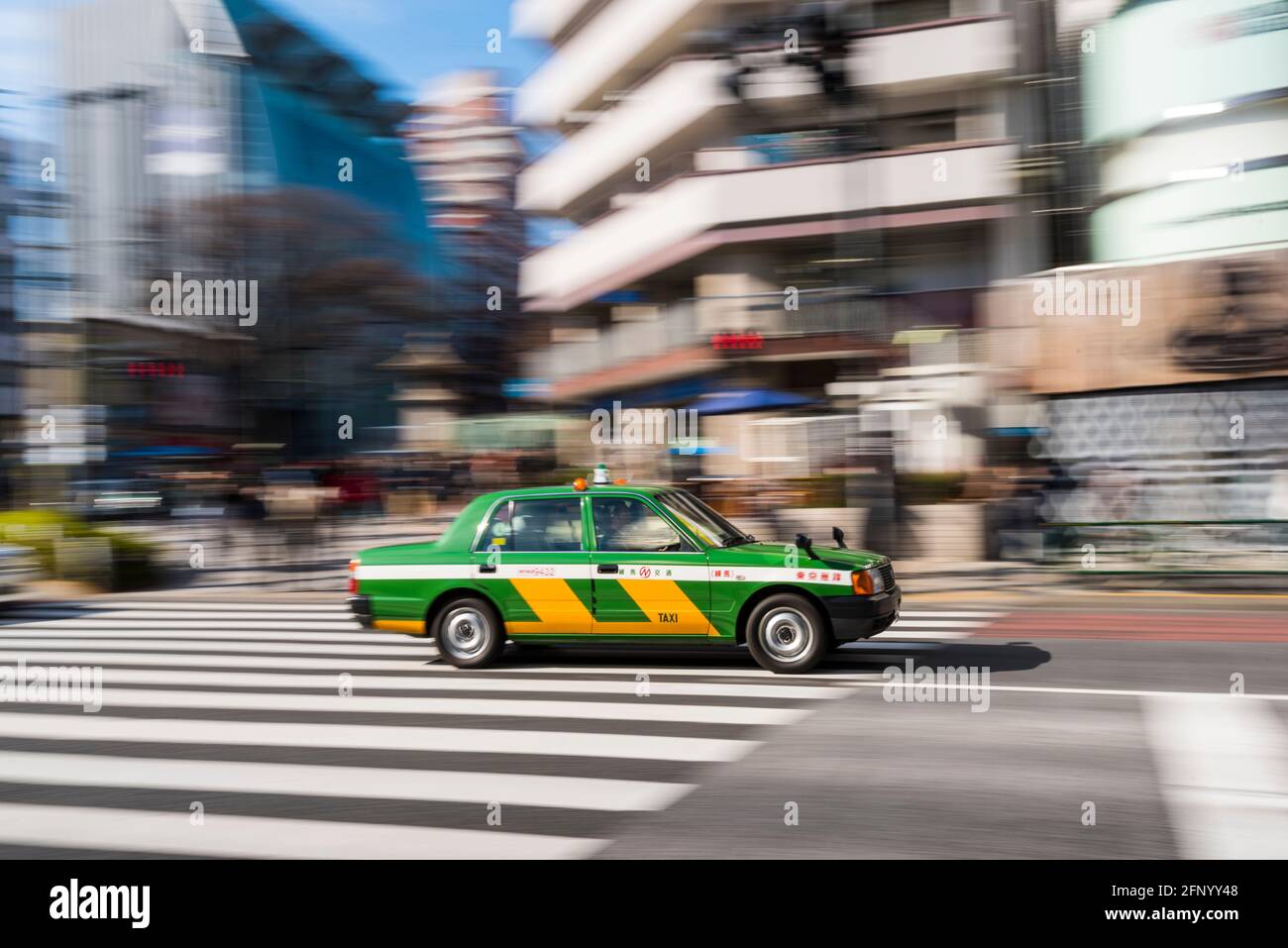 Tokyo, Japan - January 14, 2016: taxi on the crossing of Omotesando and Aoyama-dori in Shibuya, Tokyo Stock Photo