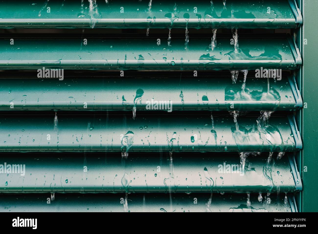 Raindrops and drip water on the shutter, detail Stock Photo