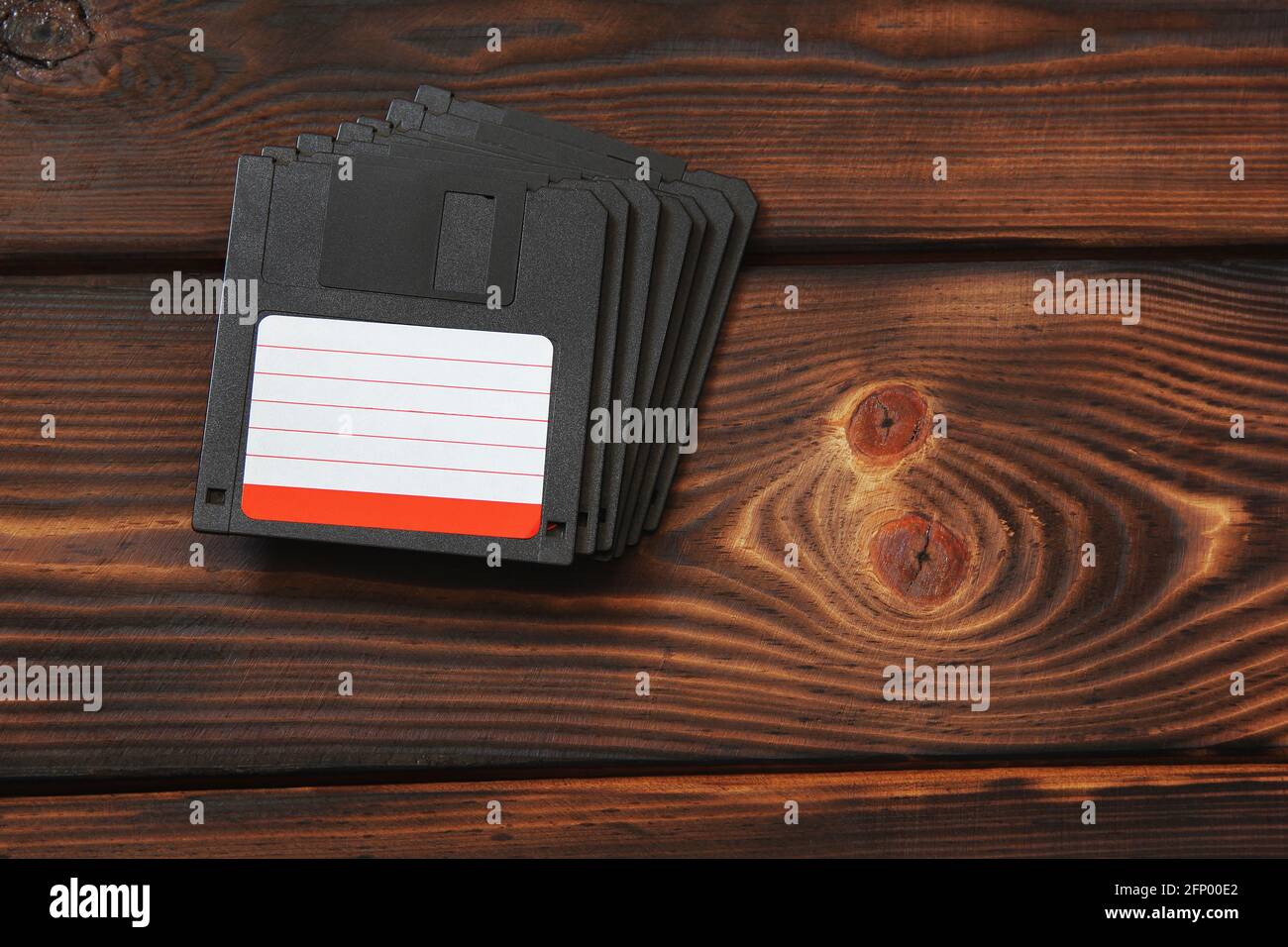 Diskettes on wooden background Stock Photo