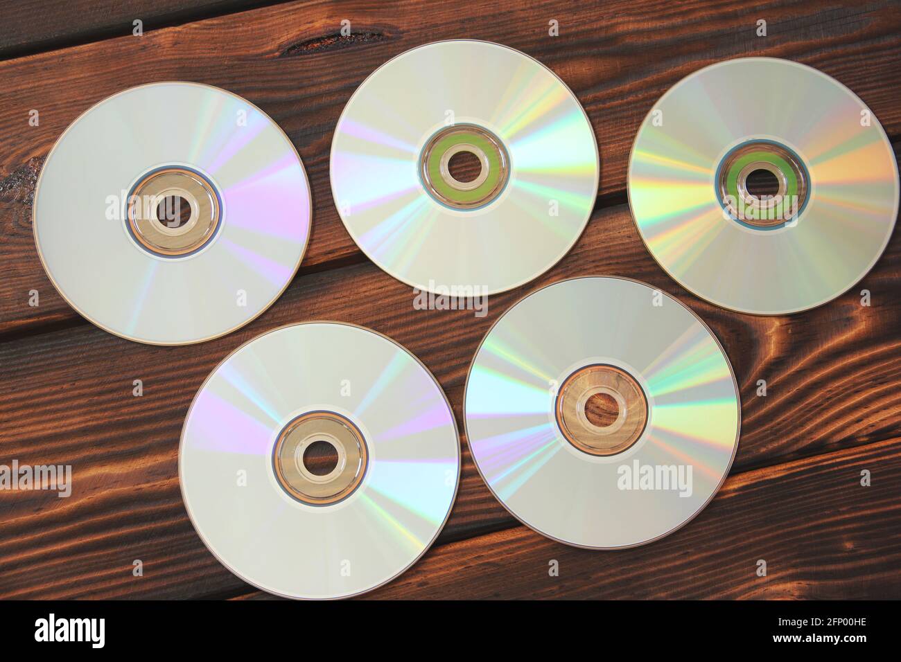 Computer disks on a wooden background Stock Photo