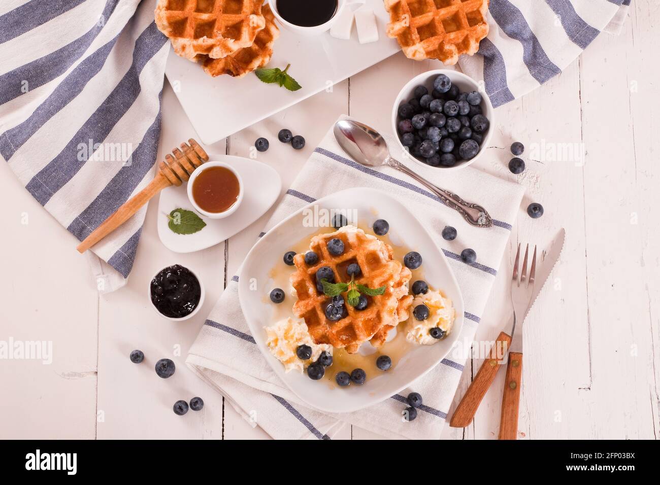 Waffles with blueberries and whipped cream Stock Photo - Alamy