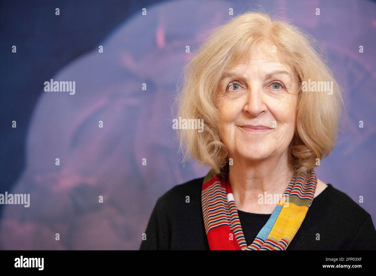 Deptford, London, 17 April 2021: The artist Mali Morris, painter and print-maker, with one of her paintings as the backdrop. She is a Member of the Royal Academy and one of the selecting judges for the 2021 RA Summer Exhibition. Anna Watson/Alamy Stock Photo