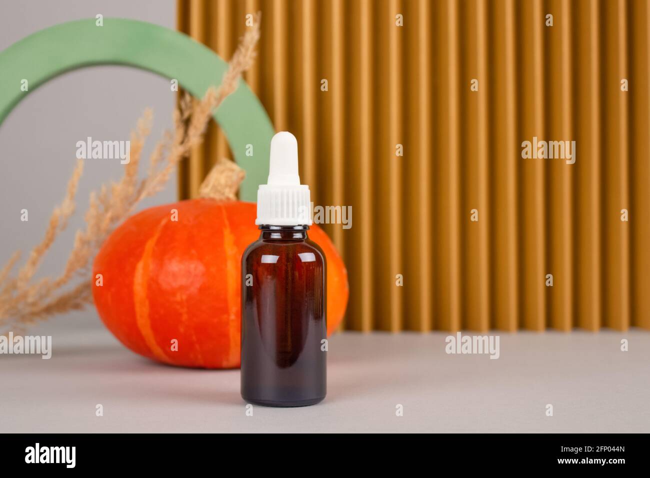 Still life composition with dropper bottle of natural organic cosmetics