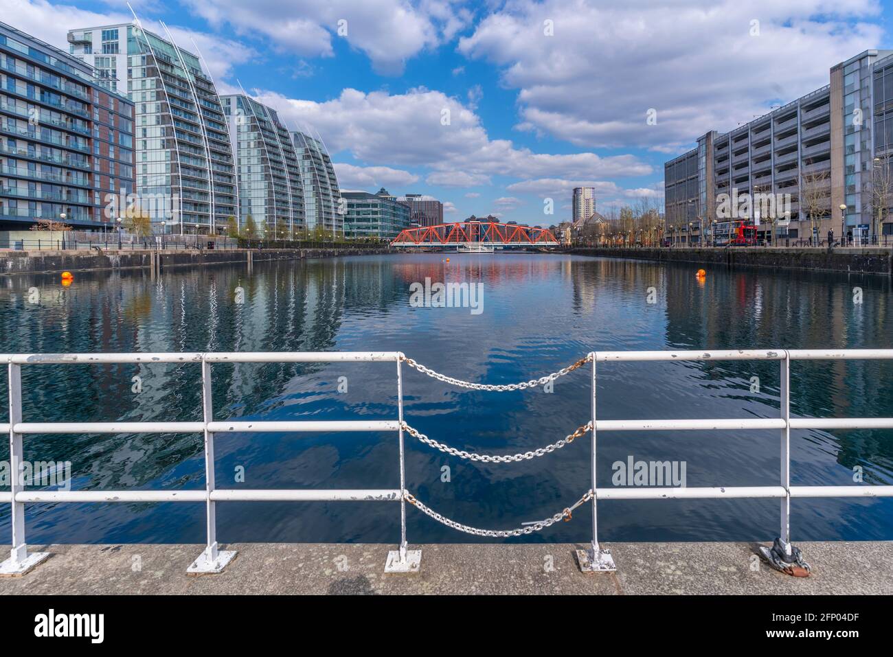 View of modern apartments reflection in water in Salford Quays