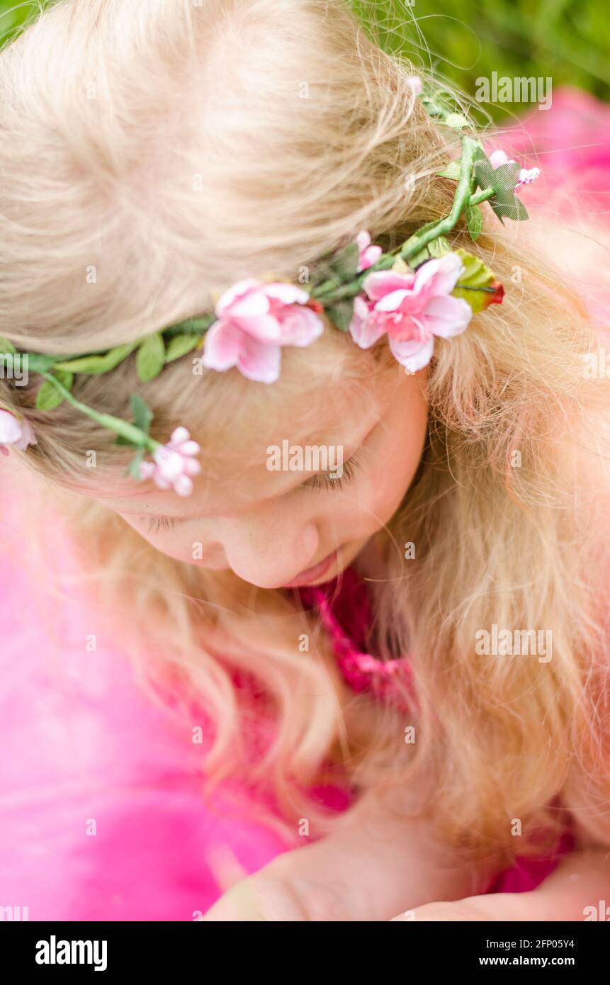 beautiful girl in pink dress with long blond hair Stock Photo - Alamy