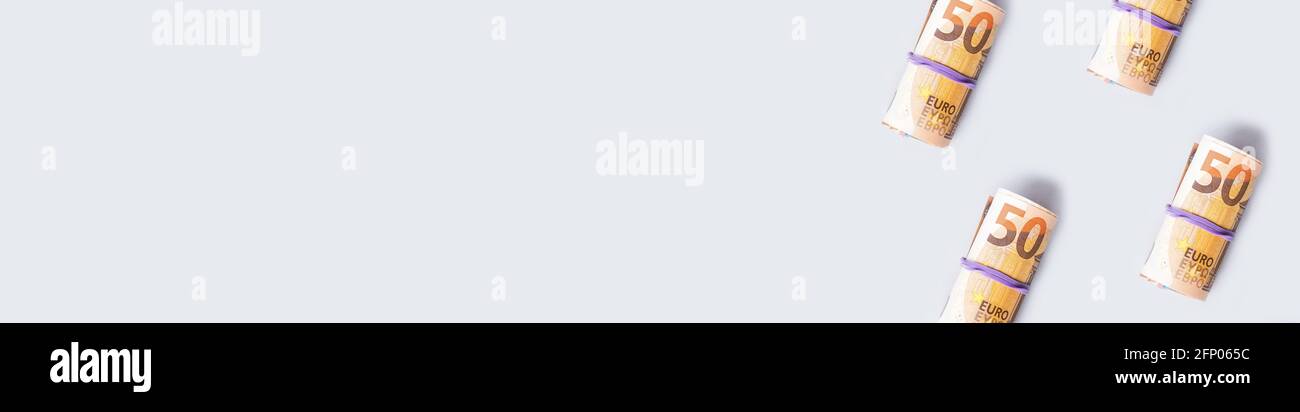 Euro 50 value banknotes roll pattern on gray background, web banner ...