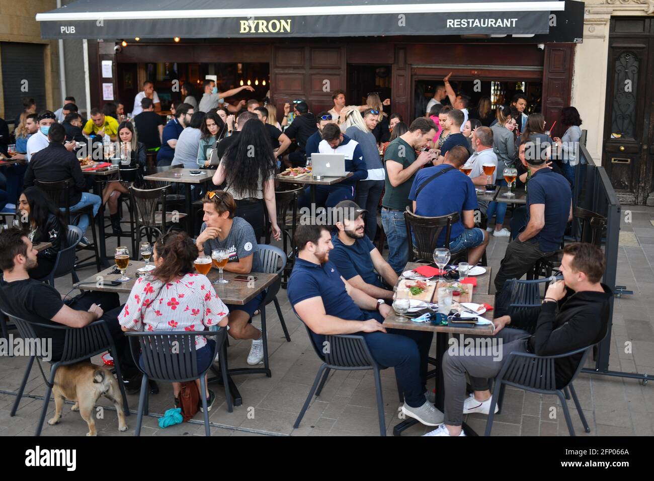 People enjoying outside weather as the reopening of cafes, bars and