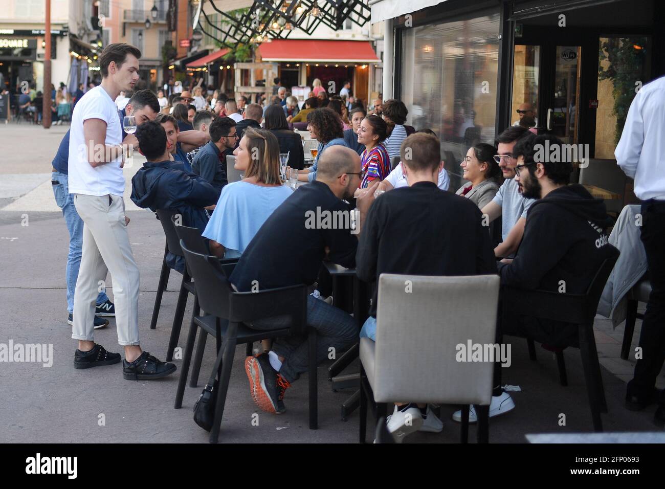 People enjoying outside weather as the reopening of cafes, bars and