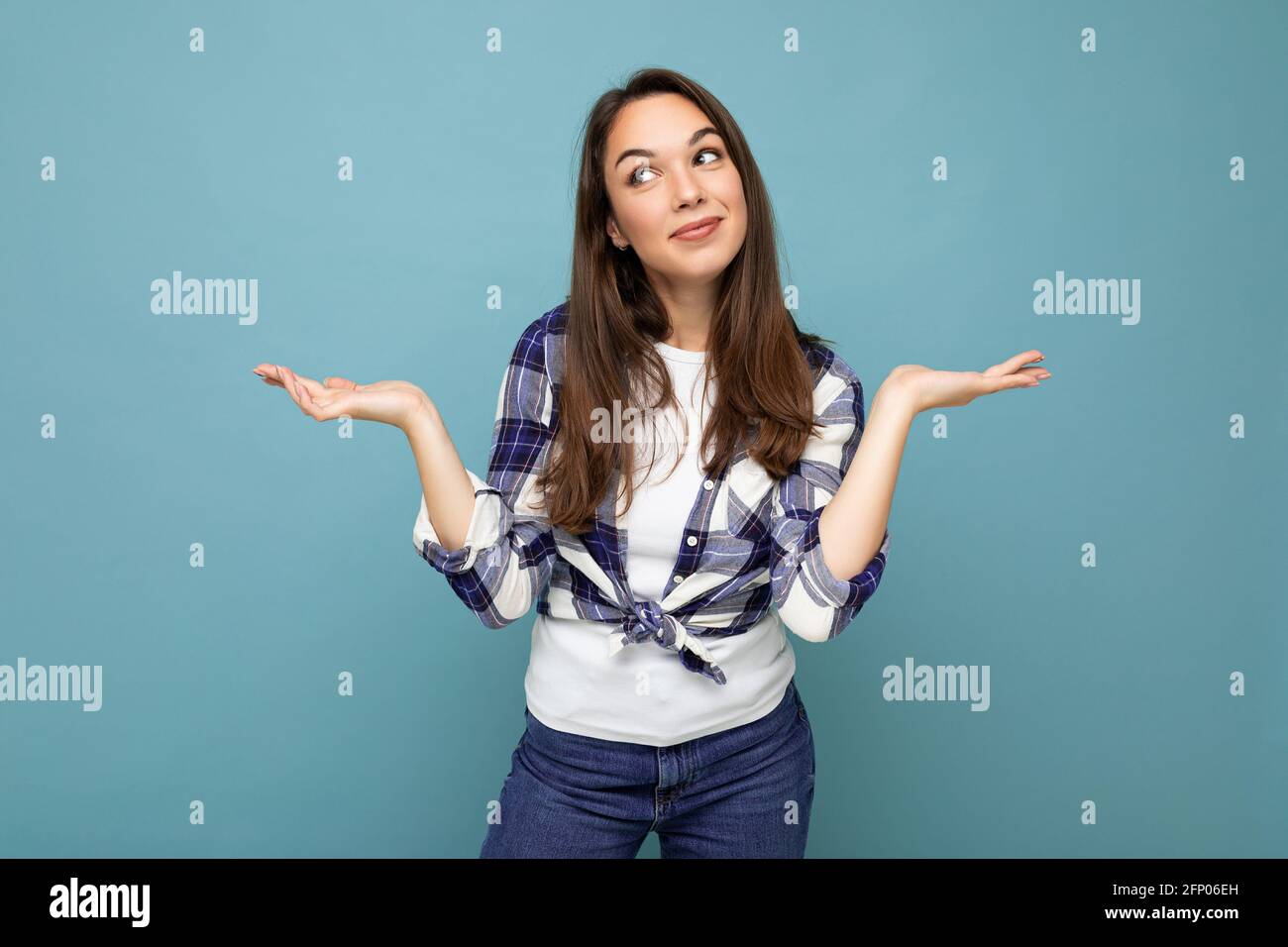 Photo of young positive happy smiling beautiful woman with sincere emotions wearing stylish clothes isolated over background with copy space and Stock Photo