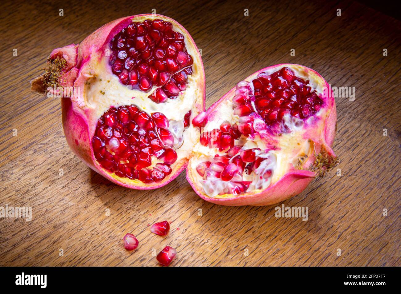Pomegranate cut in half. Stock Photo