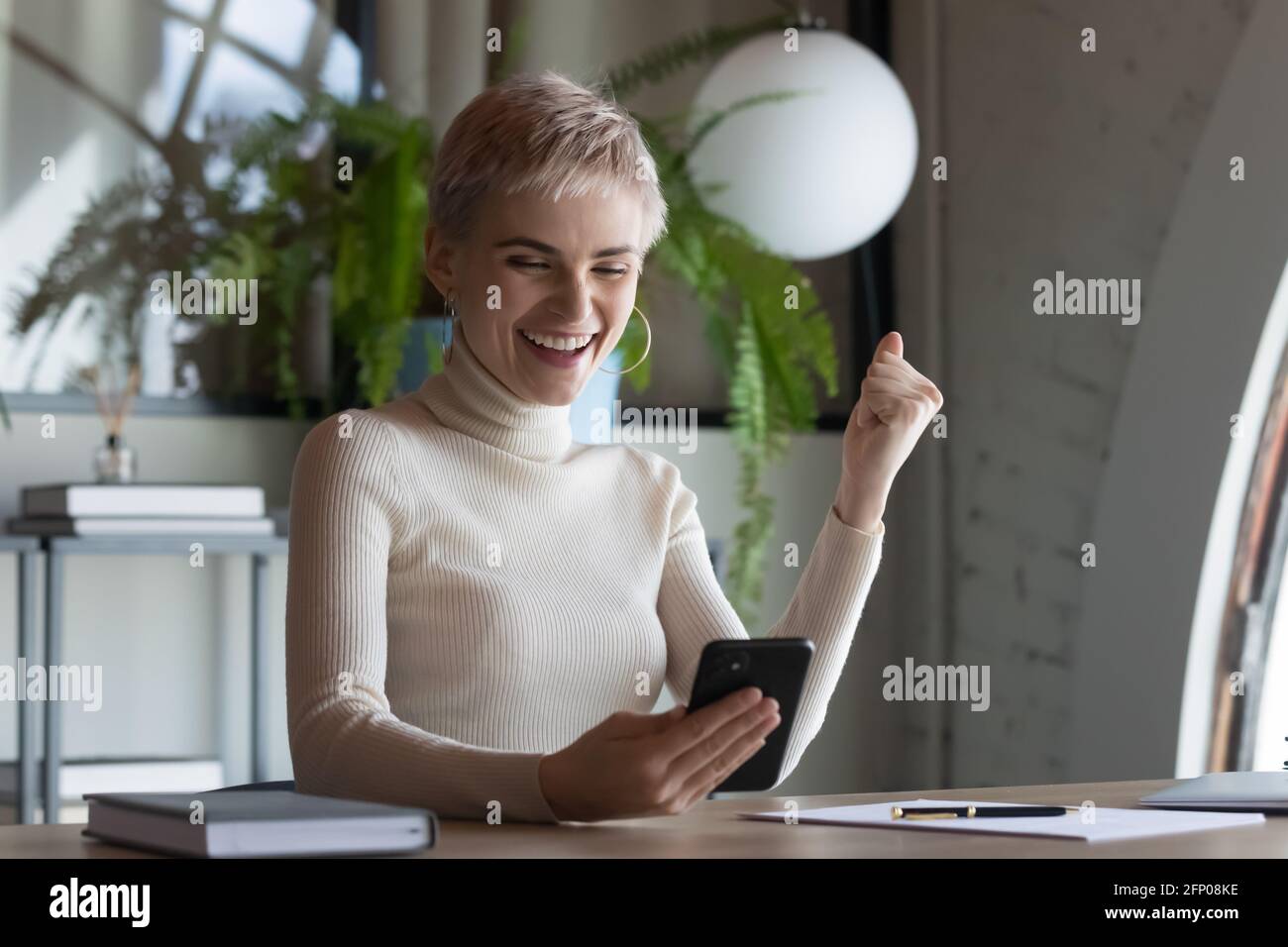 Excited woman employee triumph hi-res stock photography and images - Alamy
