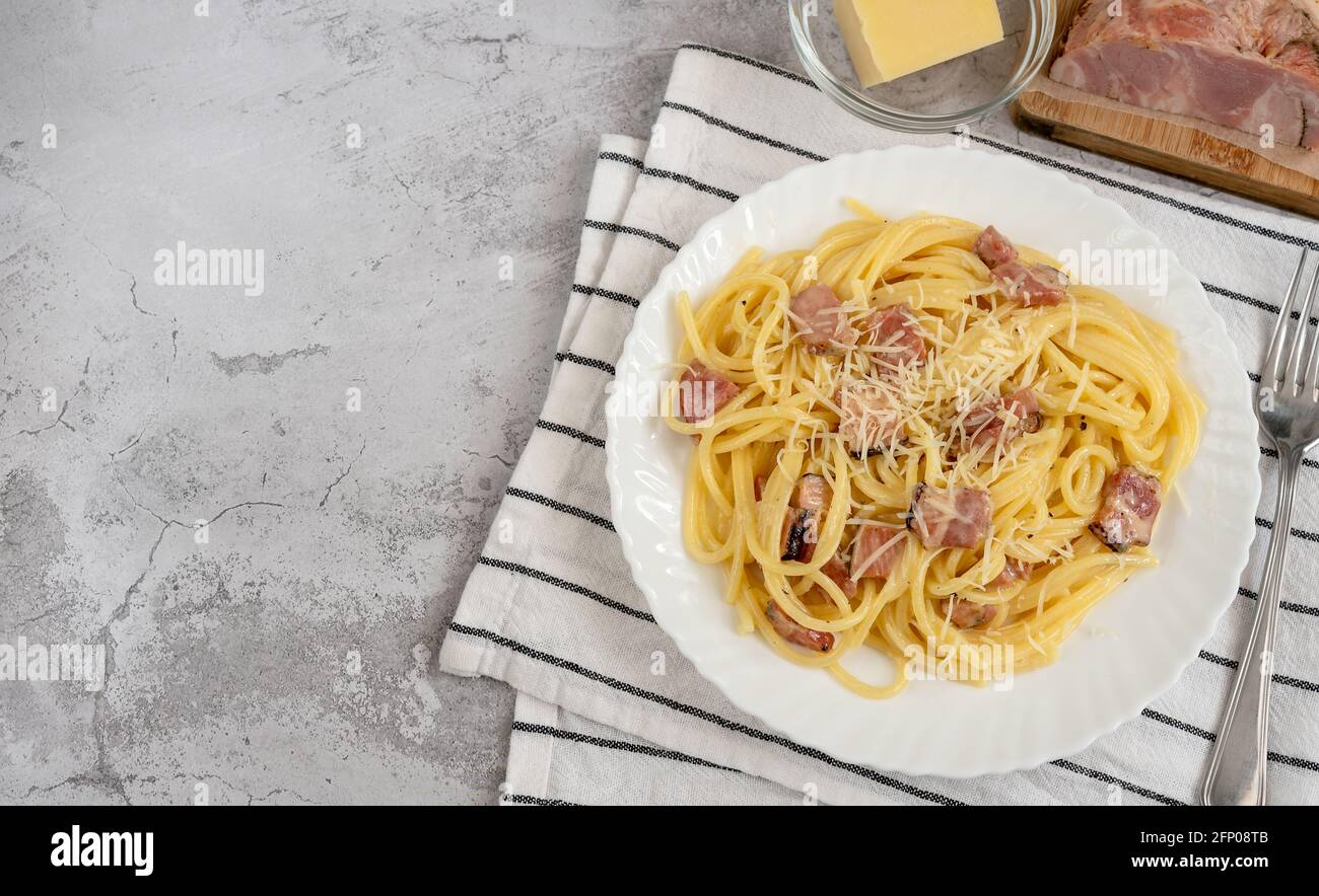 Spaghetti Carbonara With Pancetta And Pecorino Romano Cheese On A White Plate Stock Photo Alamy