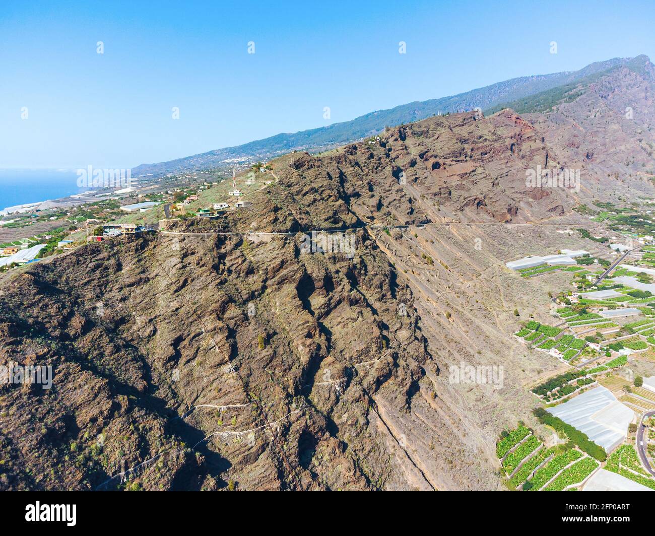 Drone view of Tazacorte and part of Caldera de Taburiente volcano on LaPalma island. Banana plantations. Stock Photo