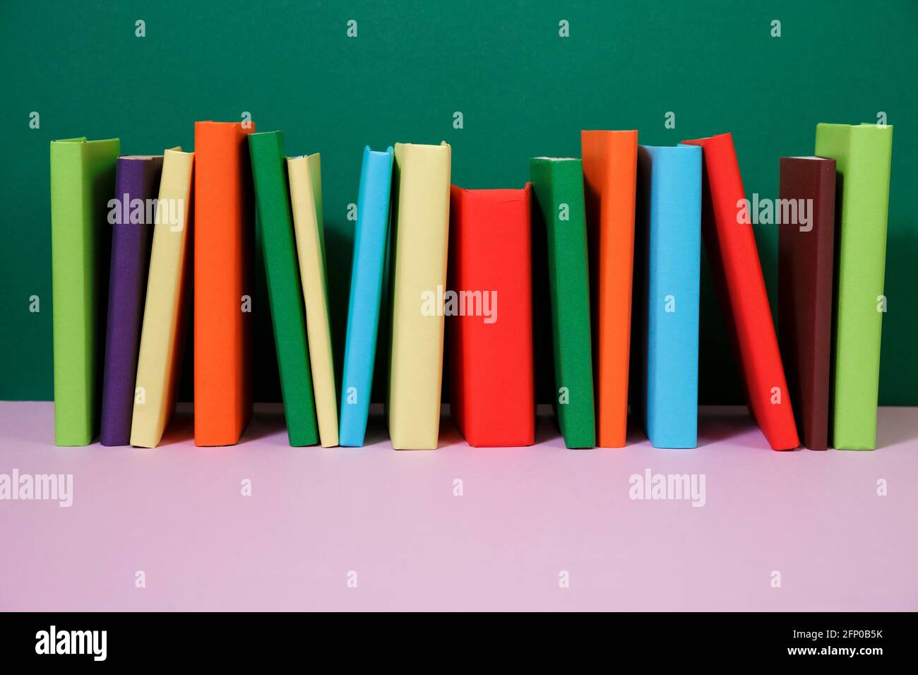 Composition with vintage old hardback books, colored background. Books ...