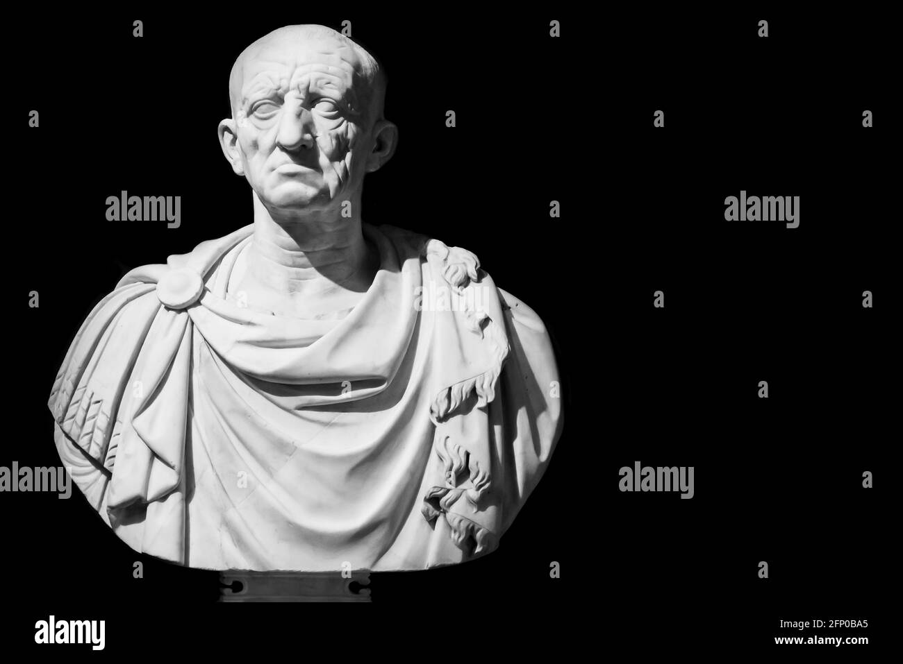 Black and white photo in close-up on ancient bust of a senior roman senator Stock Photo