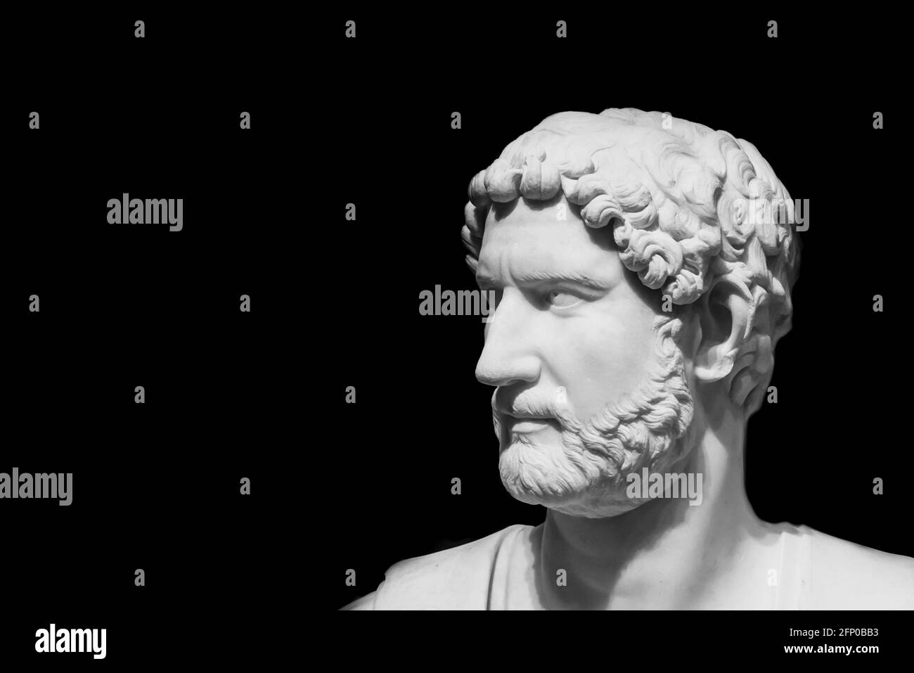 Black and white photo of male profile of ancient roman statue Stock Photo