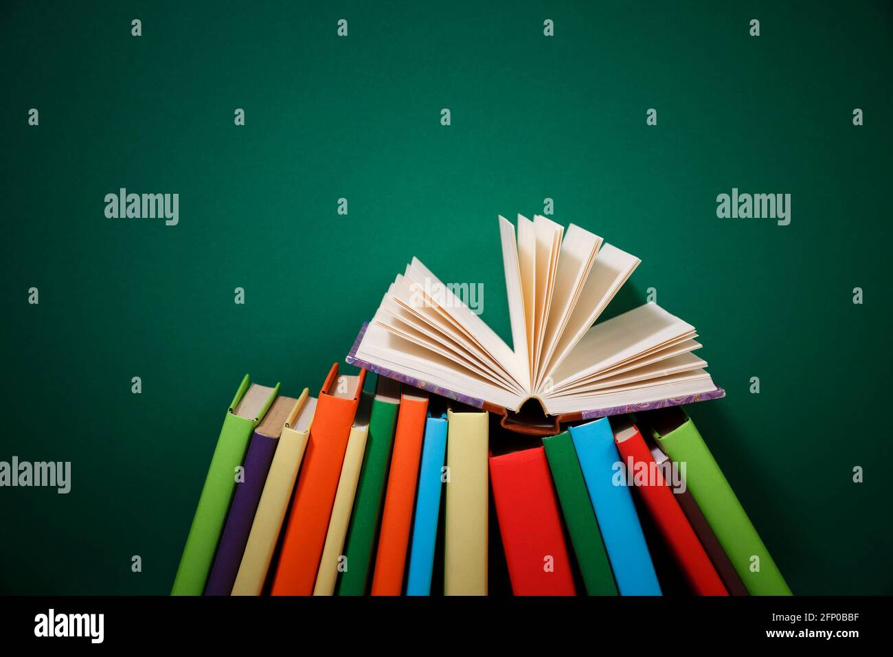 Composition with vintage old hardback books, diary, fanned pages on ...