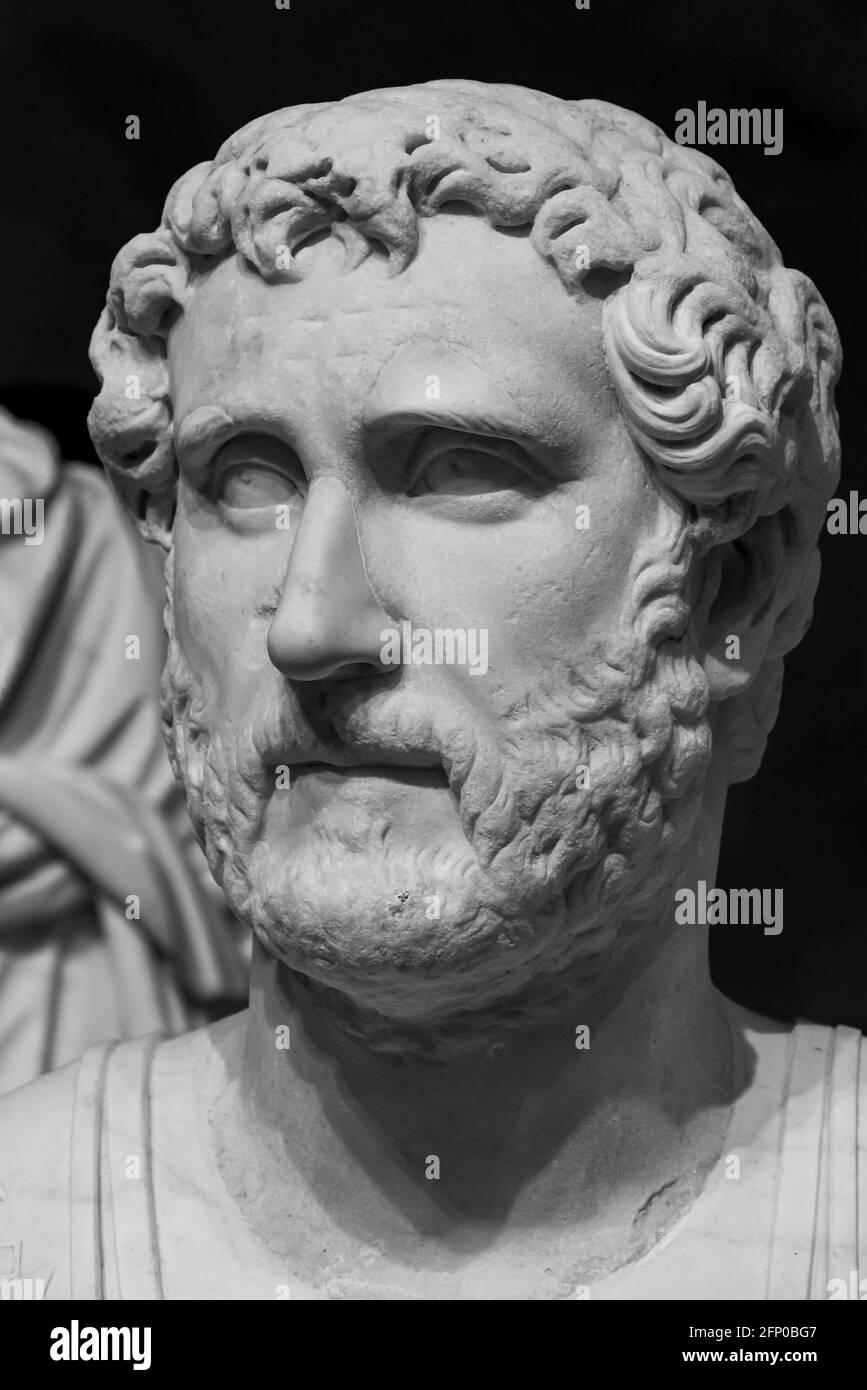 Black and white photo in close-up of ancient statue of a roman man Stock Photo