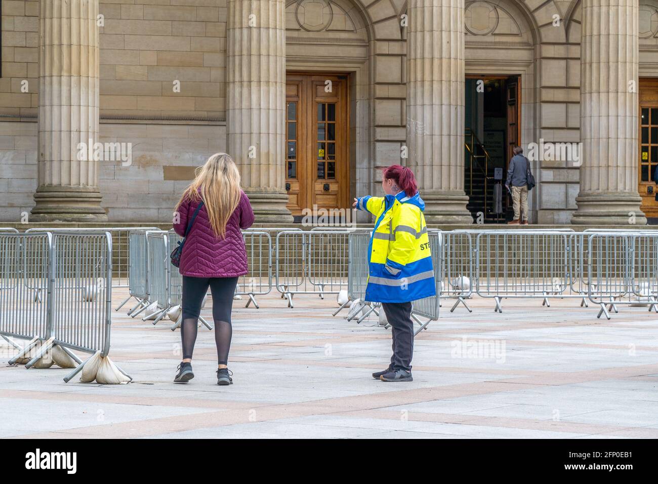 Members of the public queue at a mass NHS Tayside covid-19 vaccination centre, at the Caird Hall, City Square, Dundee, Tayside, Scotland. Stock Photo