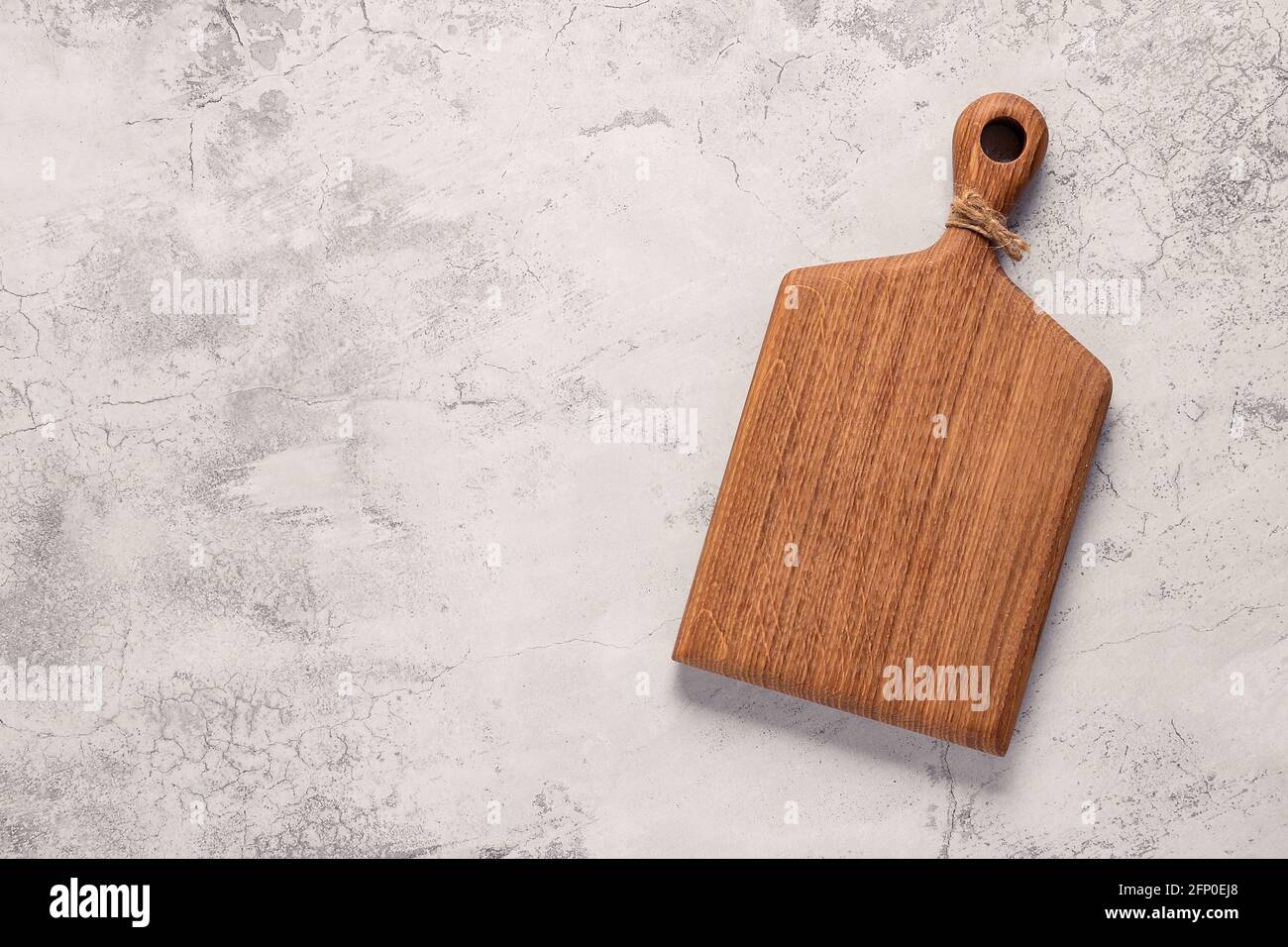 cutting board on a concrete table, top view Stock Photo
