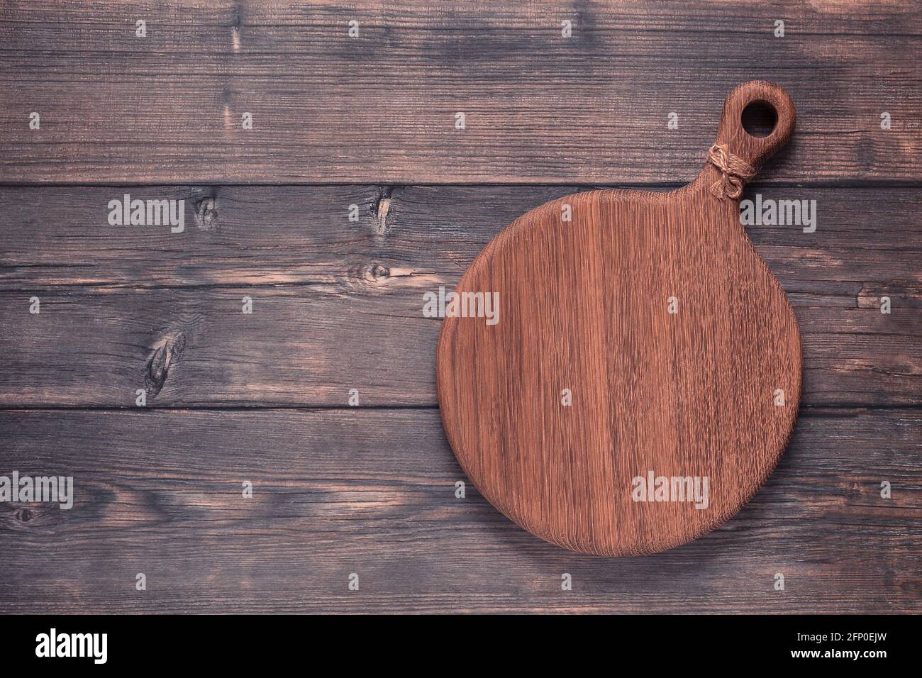 cutting board on a wooden table, top view Stock Photo