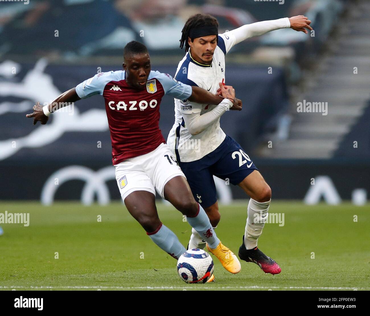 Aston Villa's Marvelous Nakamba (left) and Tottenham Hotspur's Dele Alli battle for the ball during the Premier League match at the Tottenham Hotspur Stadium, London. Picture date: Wednesday May 19, 2021. Stock Photo