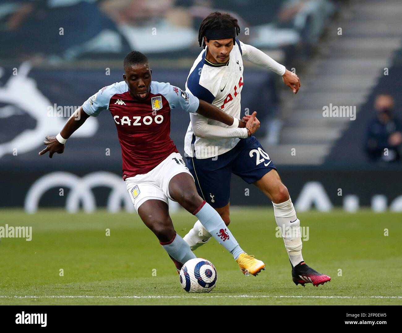 Aston Villa's Marvelous Nakamba (left) and Tottenham Hotspur's Dele Alli battle for the ball during the Premier League match at the Tottenham Hotspur Stadium, London. Picture date: Wednesday May 19, 2021. Stock Photo