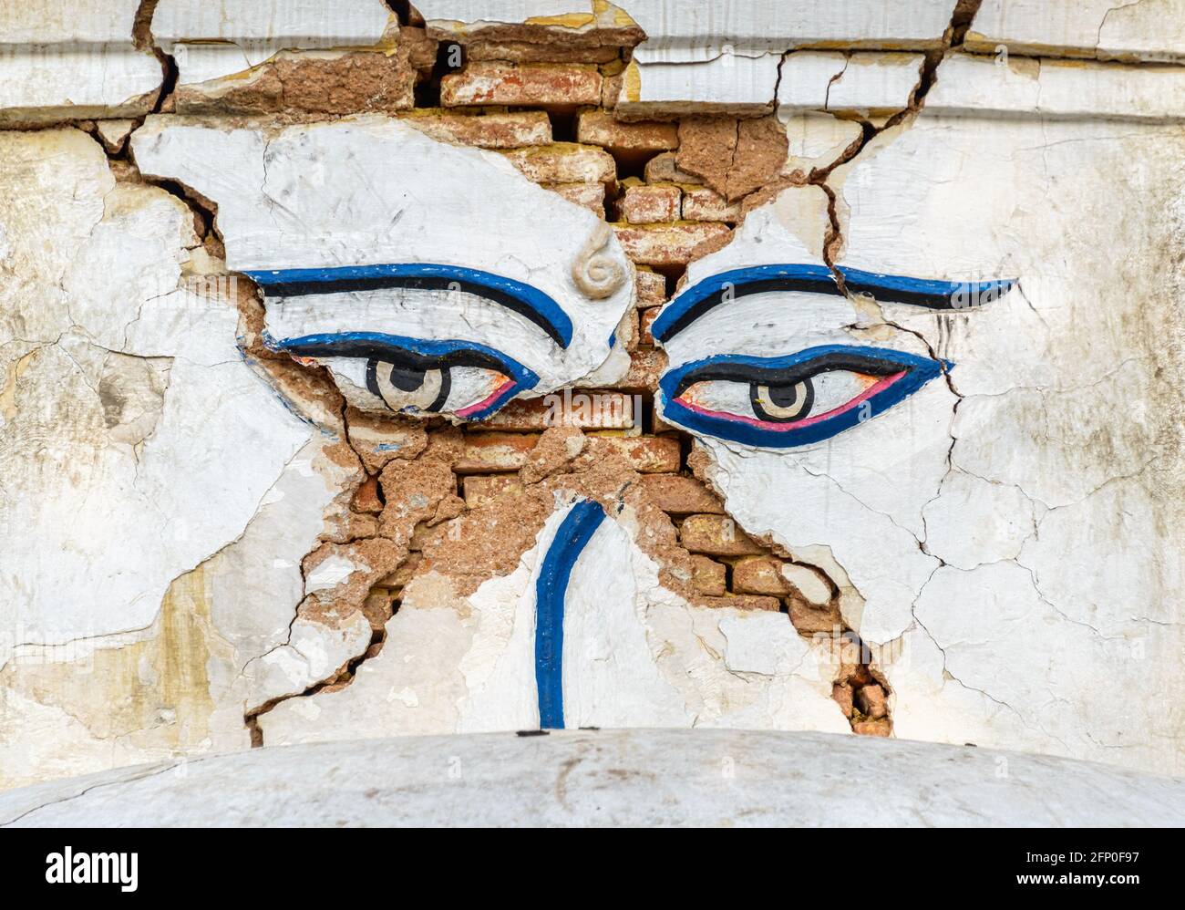 Earthquake damaged Buddha's eyes at Swayambhunath in Kathmandu, Nepal Stock Photo