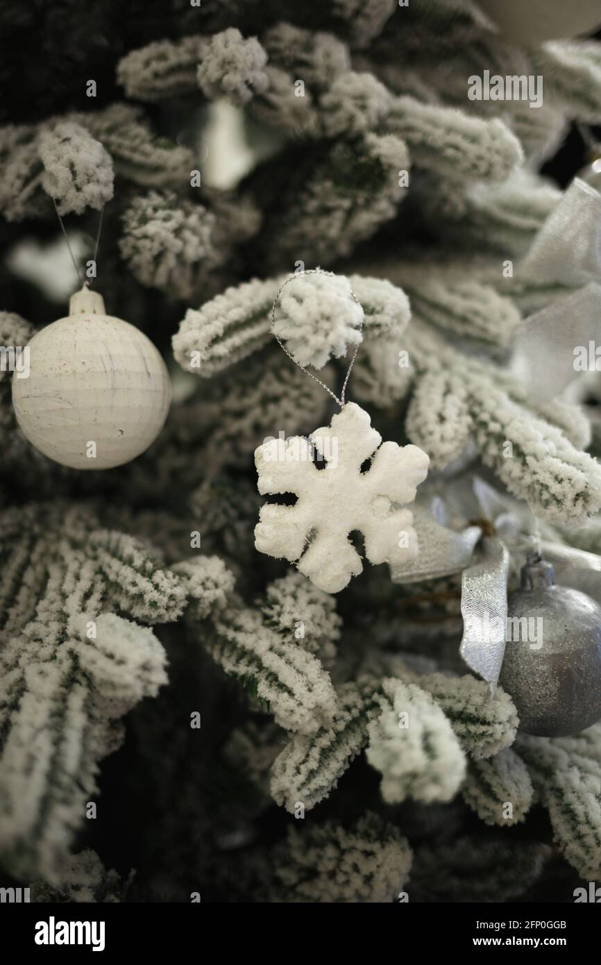 star and ball hanging on the christmas tree. Stock Photo