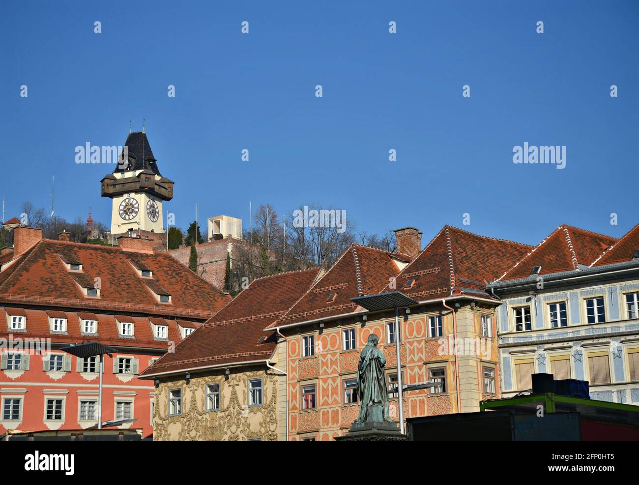 Scenic view of Baroque style buildings and the Uhrturm the 13th century ...