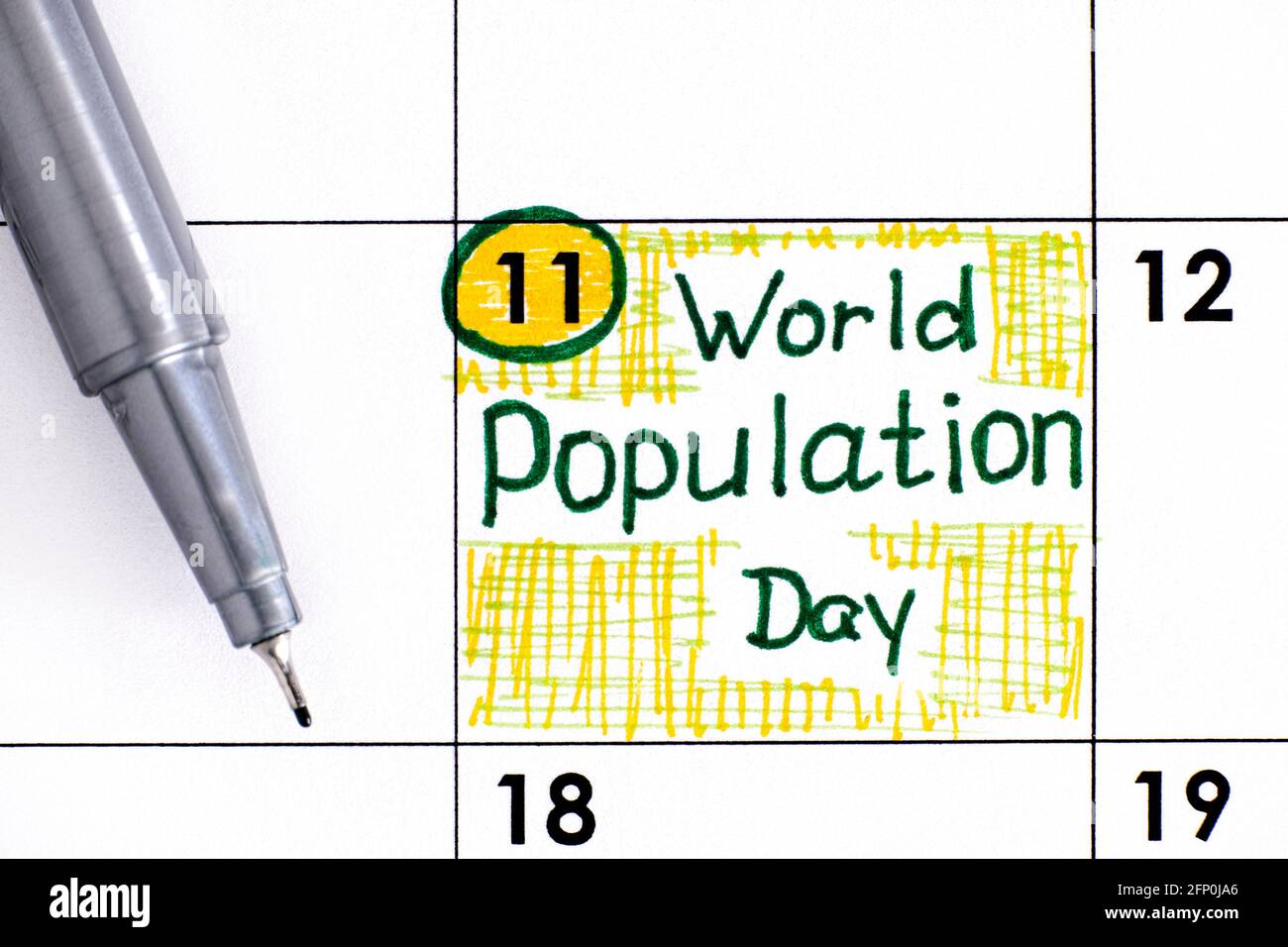 Reminder World Population Day in calendar with pen. July 11 Stock Photo