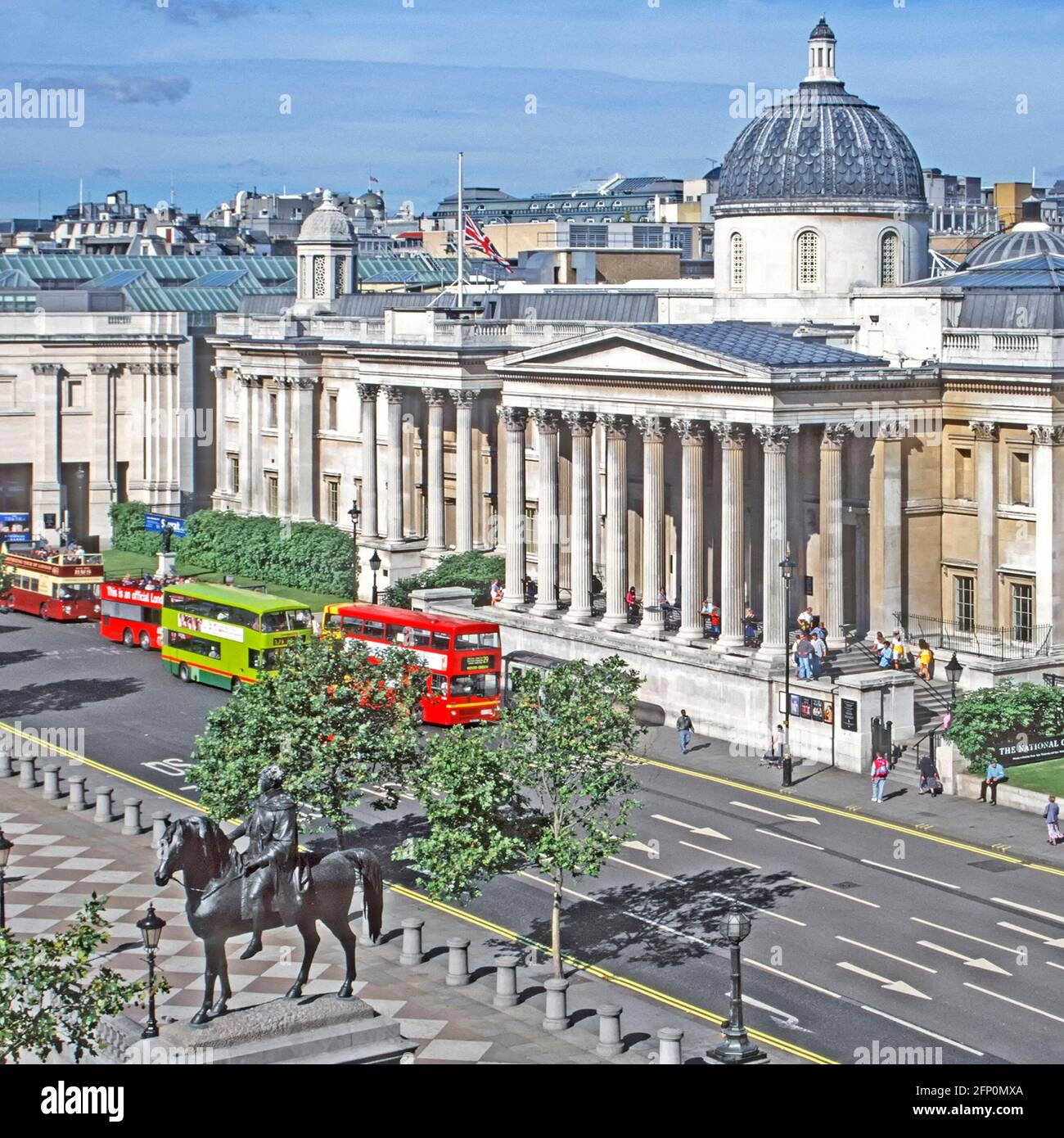 Aerial 1997 historical view double decker buses at bus stop for National Gallery before this part of Trafalgar Square London was pedestrianized 90s UK Stock Photo