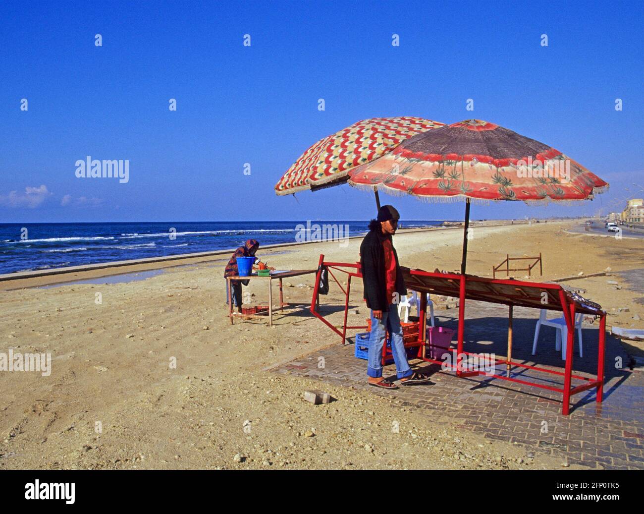 Fishmonger sells fish on the beach, Benghazi, Libya Stock Photo
