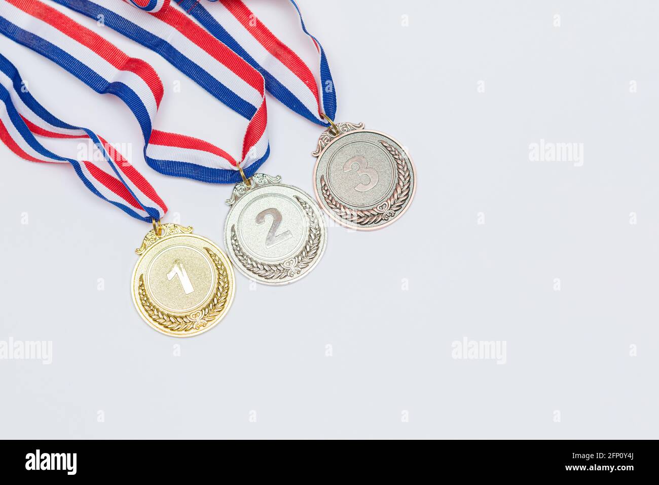 Gold, silver and bronze sports achievement medals for first, second and ...