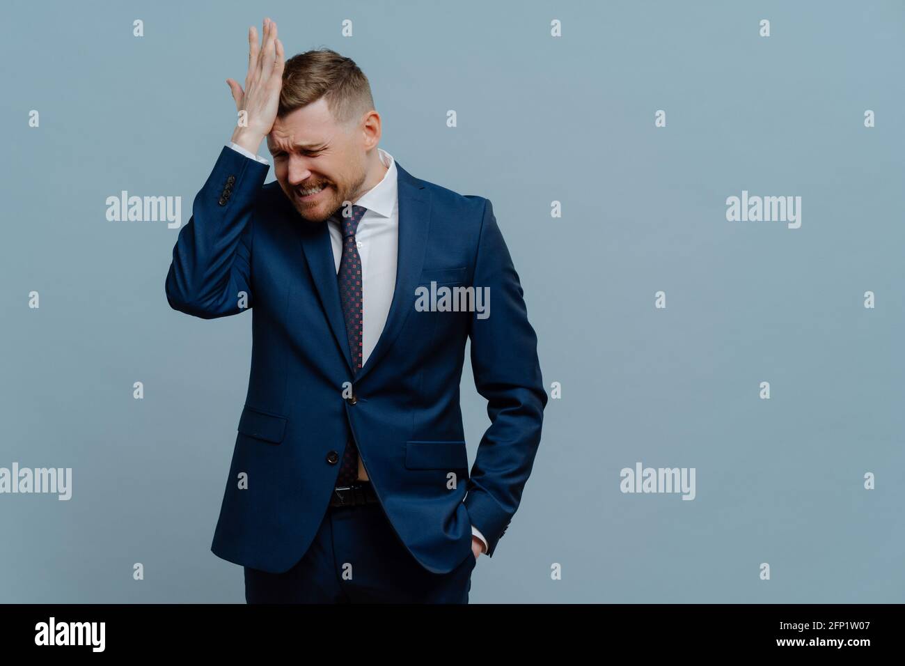 Stressed businessman feeling apset of business failure Stock Photo