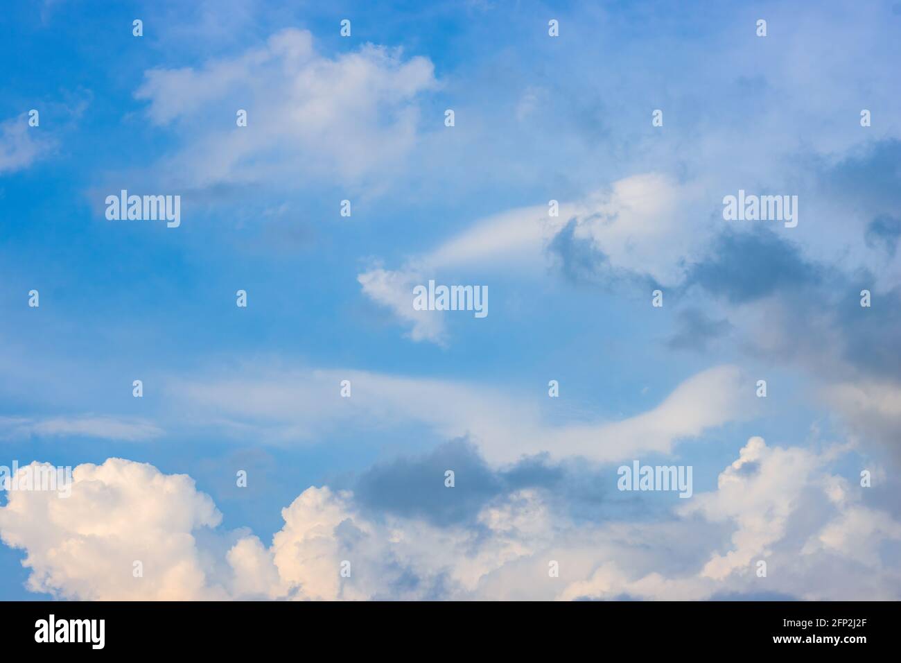 Clean blue sky with soft white clouds Stock Photo - Alamy