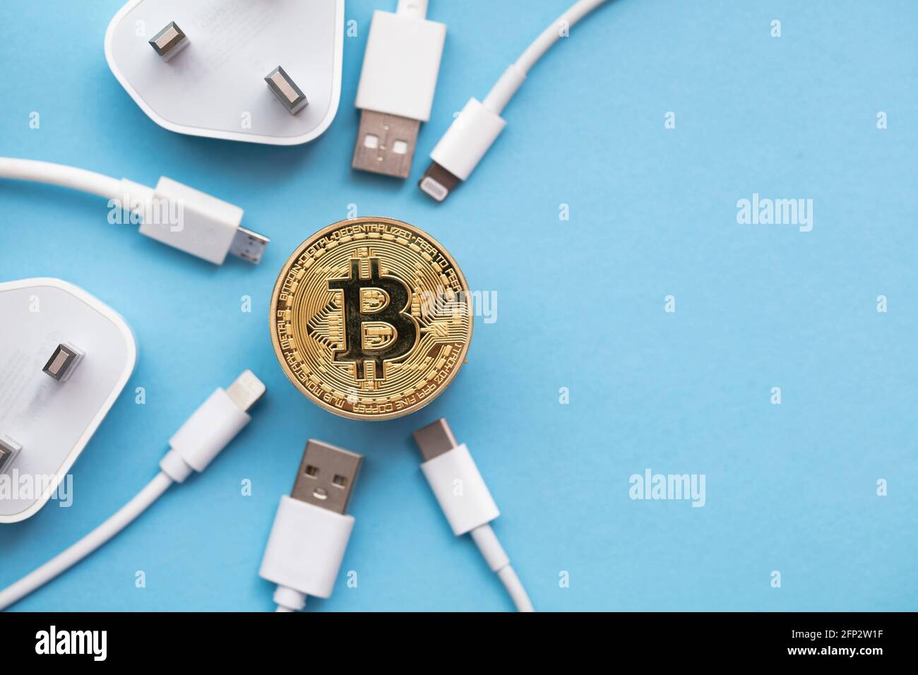 bitcoin cryptocurrency energy consumption concept. Gold coin with electric  plug Stock Photo - Alamy