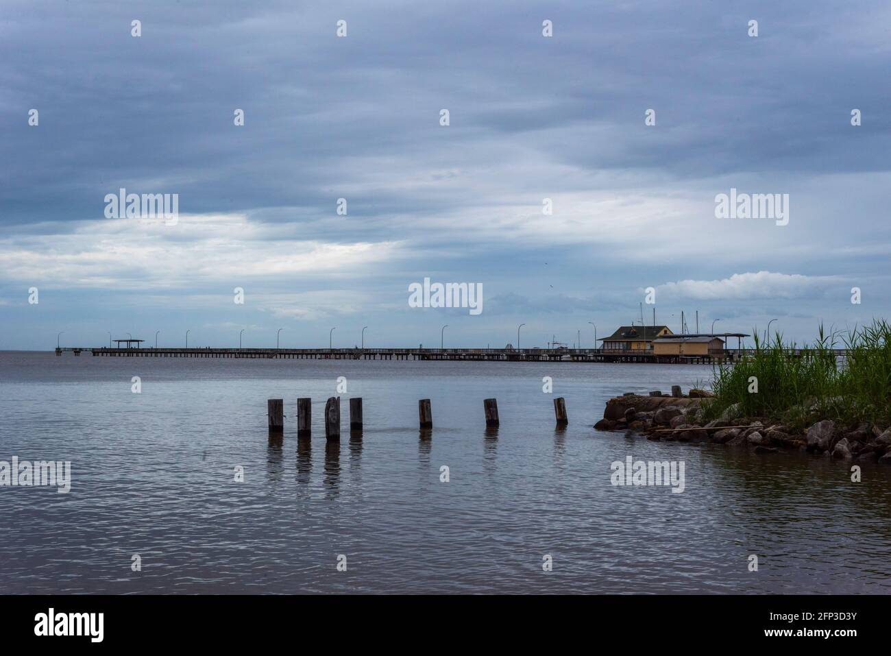 The Fairhope Municipal Pier stretches into Mobile Bay in Fairhope, Alabama, on May 19, 2021. Stock Photo