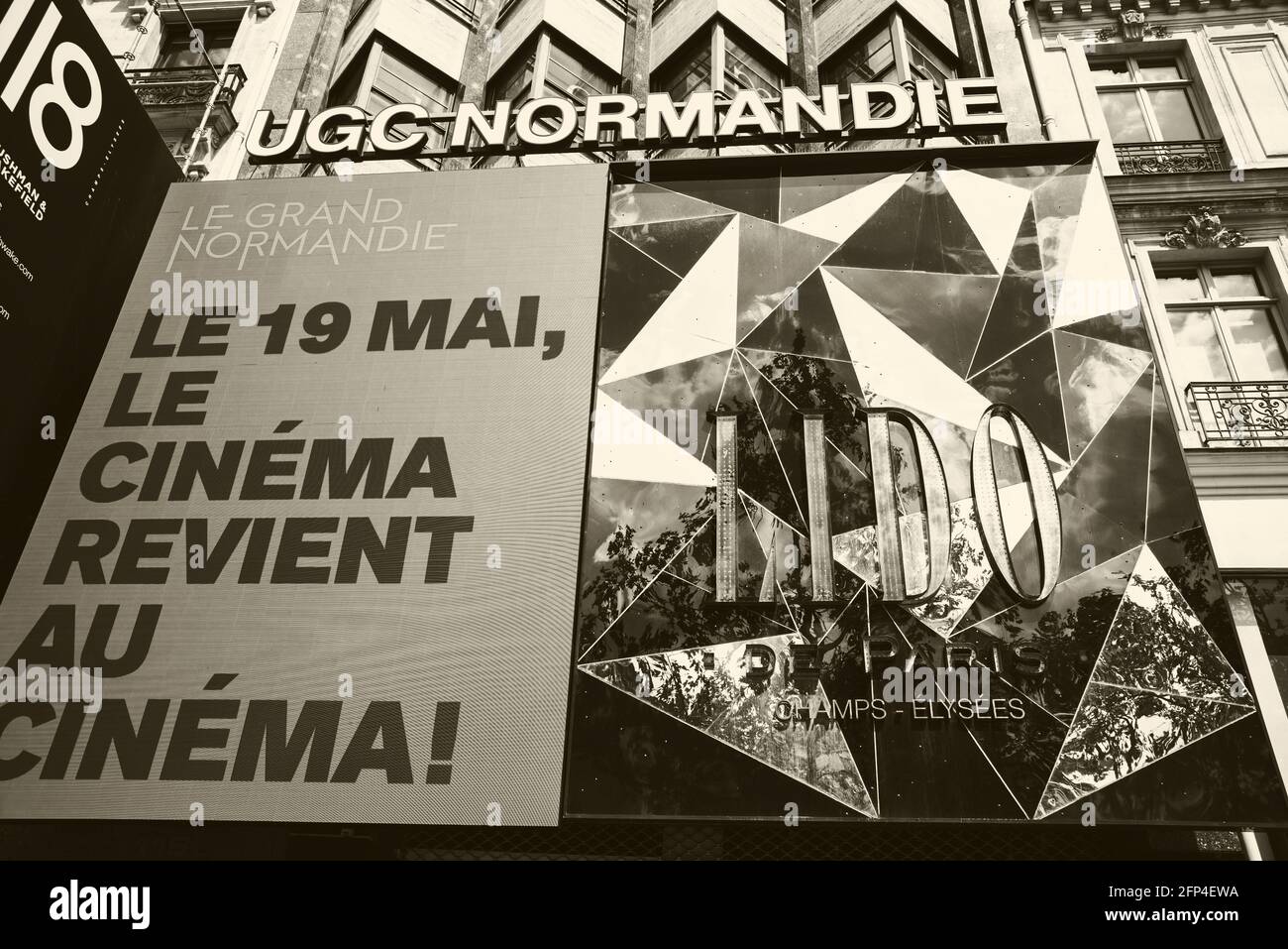 Paris, France. Poster over UGC Normandie cinema on Avenue des Champs-Elysees  informing that from May 19 cinema will be reopened. Life during covid-19  Stock Photo - Alamy