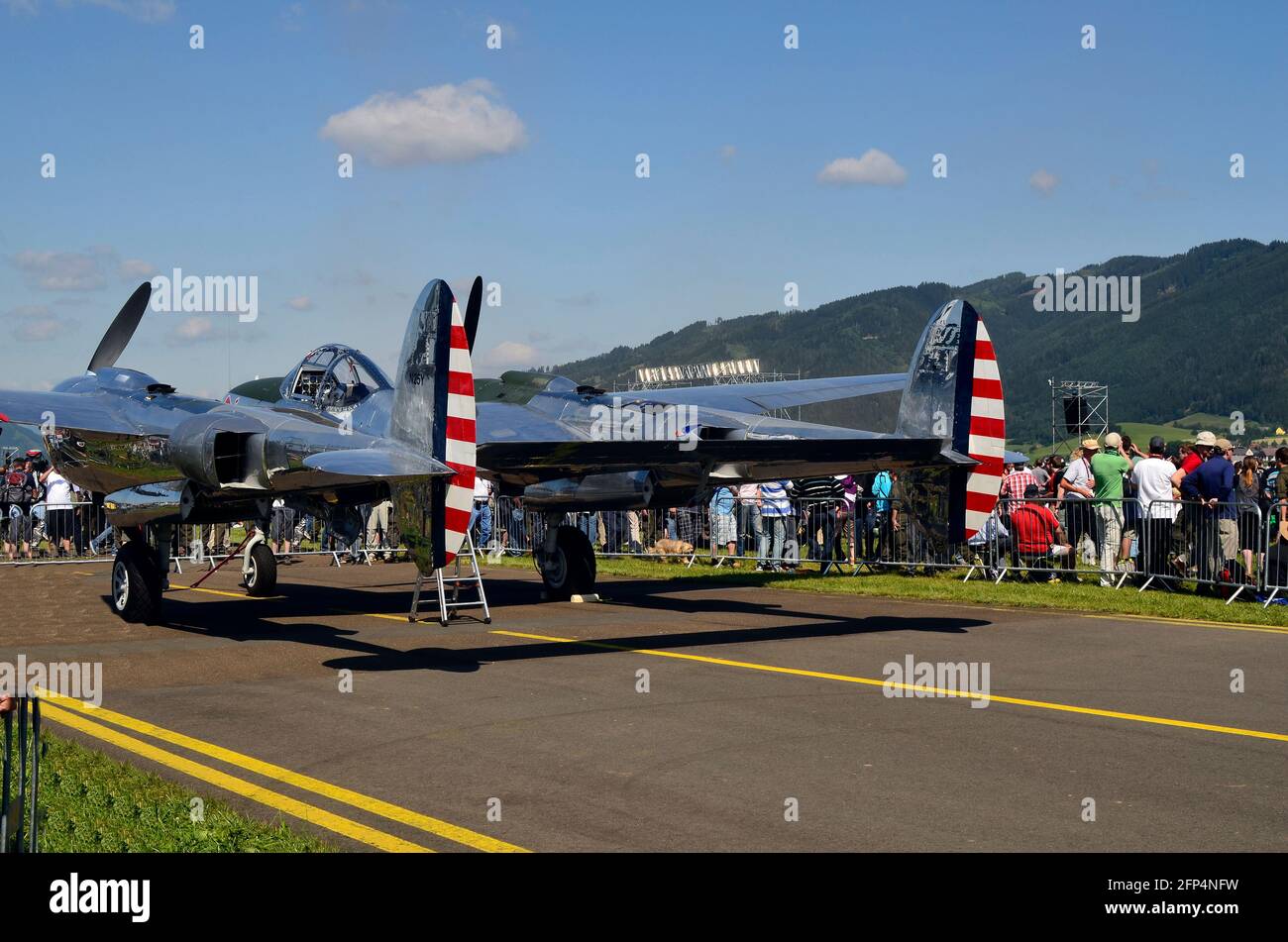 Zeltweg, Austria - July 1st 2011: Unidentified people and WWII aircraft fighter Lockheed P38 Lightning by public airshow - airpower11 - in Styria Stock Photo