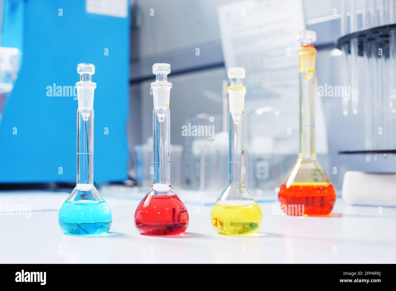 Test tubes and flasks with test liquid on the table in a chemical lab