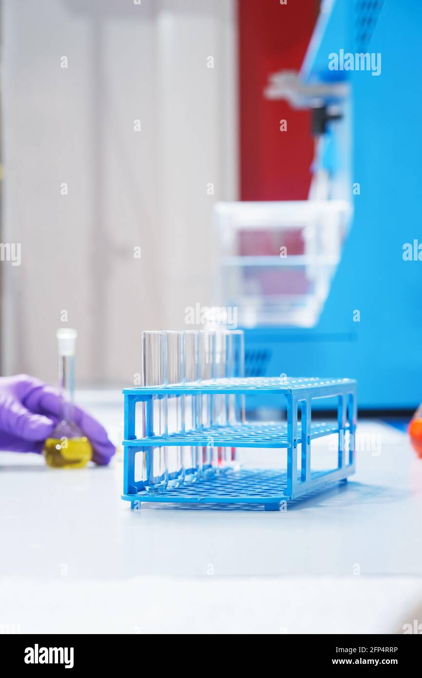Test tubes and flasks with test liquid on the table in a chemical lab