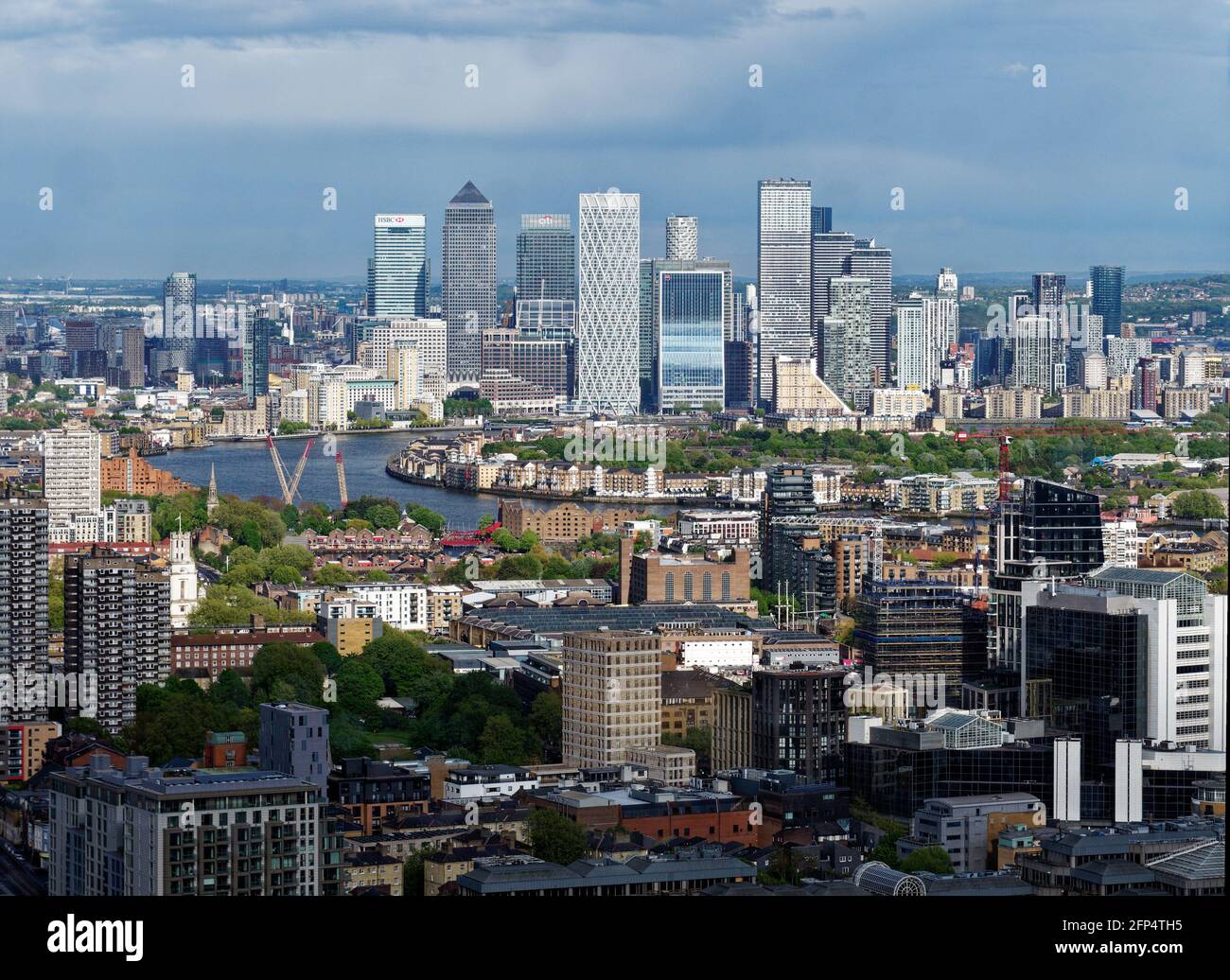 London, Greater London, England - May 18 2021: Elevated view across the River Thames towards the famous skyscrapers in the business district of Canary Stock Photo